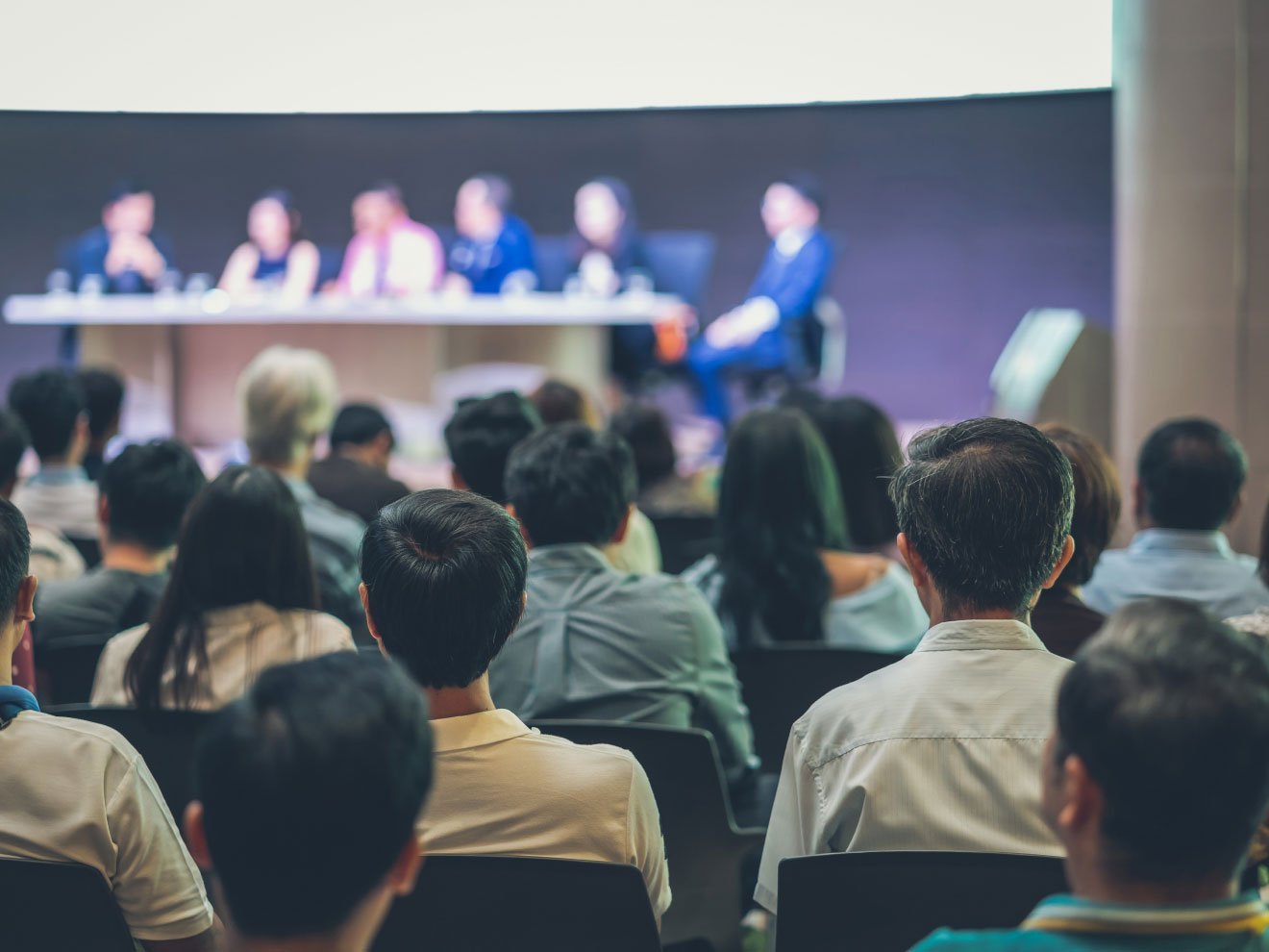 rear-view-of-audience-in-the-conference-hall-or-se-2022-12-16-03-32-42-utc-1-1.jpg